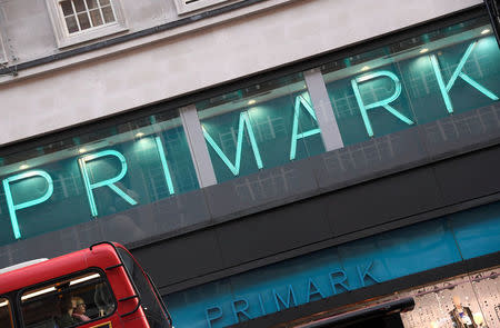 FILE PHOTO: Bus passengers pass a Primark store in central London, Britain, November 3, 2017. REUTERS/Toby Melville/File Photo