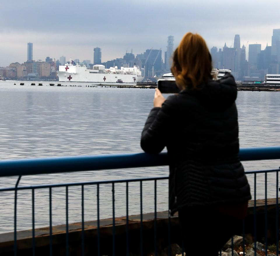 The hospital ship USNS Comfort makes its way north on the Husdon River to dock at Pier 90 in New York on Monday, March 30, 2020. The ship, serve as referral centers for non-COVID-19 patients in the New York City area.