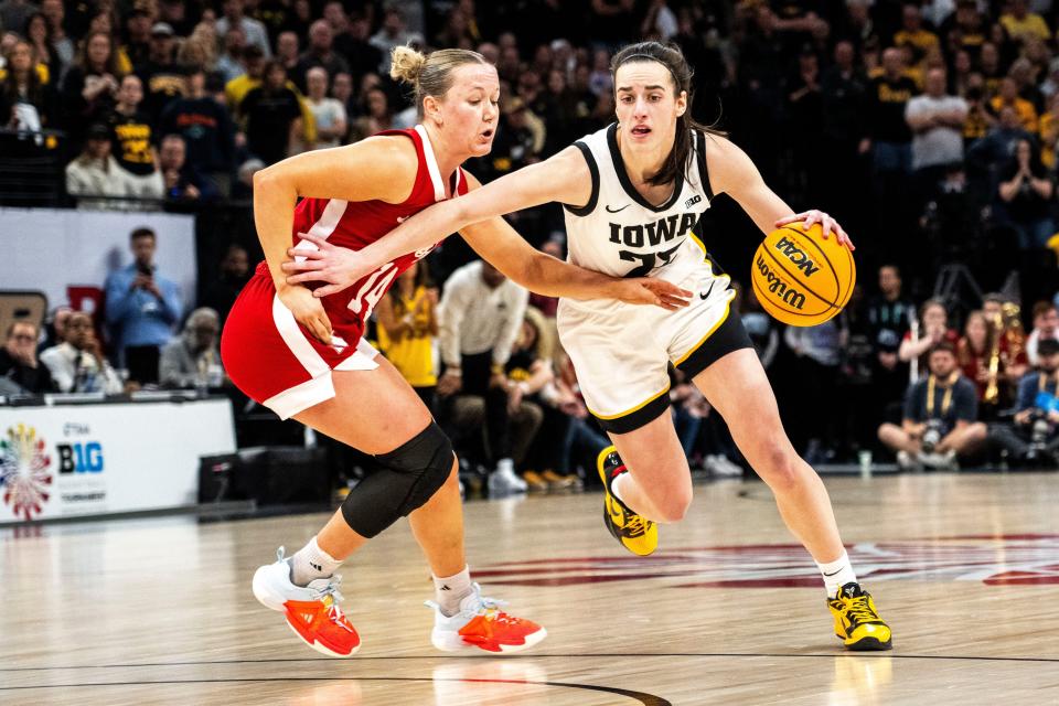 Iowa guard Caitlin Clark drives to the basket against Nebraska guard Callin Hake during the Big Ten Tournament championship game.