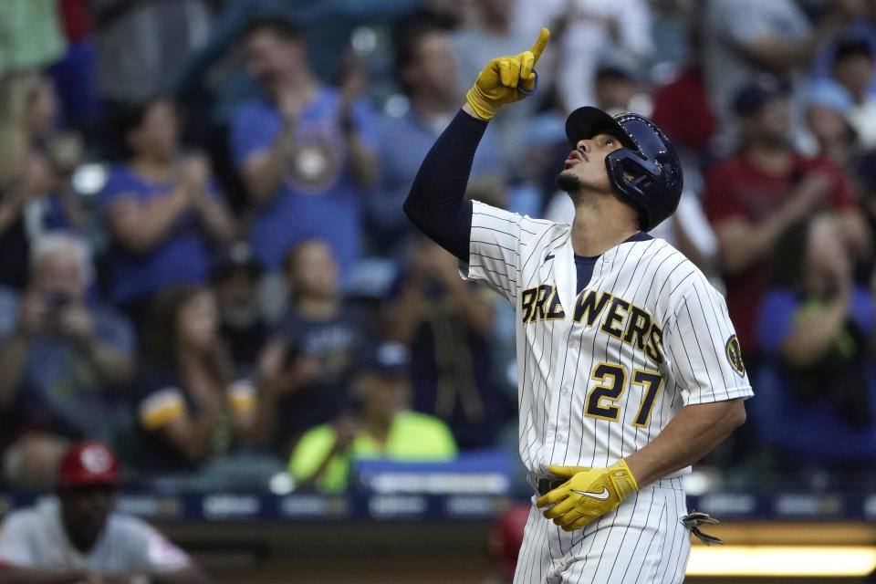 Milwaukee Brewers' Willy Adames gestures after hitting a two-run home run during the first inning of a baseball game against the Cincinnati Reds, Saturday, Sept. 10, 2022, in Milwaukee. (AP Photo/Aaron Gash)