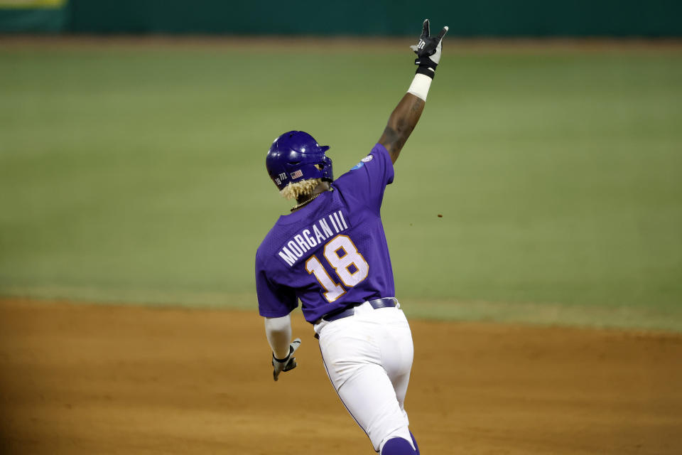 LSU's Tre' Morgan reacts after hitting a home run during the third inning of an NCAA college baseball tournament super regional game against Kentucky in Baton Rouge, La., Saturday, June 10, 2023. (AP Photo/Tyler Kaufman)