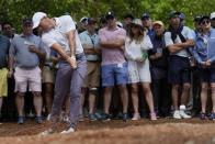 Rory McIlroy, of Northern Ireland, hits from the pine straw on the second hole during the first round at the Masters golf tournament at Augusta National Golf Club Thursday, April 11, 2024, in Augusta, Ga. (AP Photo/Ashley Landis)