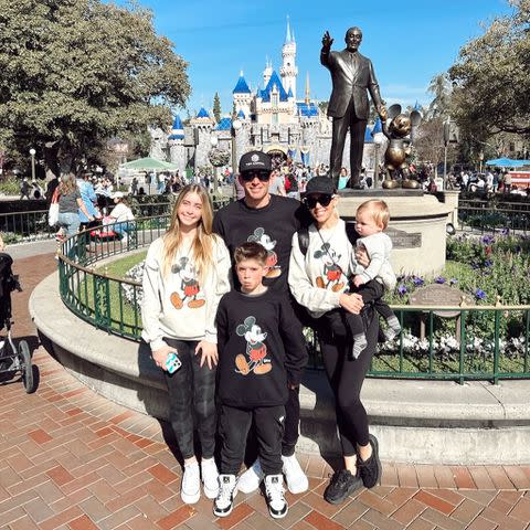 <p>Heather Rae El Moussa/Instagram</p> The family posed in front of Sleeping Beauty's castle during their outing