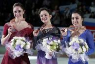 Figure Skating - ISU World Championships 2017 - Ladies Victory Ceremony - Helsinki, Finland - 31/3/17 - Gold medallist Evgenia Medvedeva (C) of Russia, silver medallist Kaetlyn Osmond (L) of Canada and bronze medallist Gabrielle Daleman of Canada attend the ceremony. REUTERS/Grigory Dukor