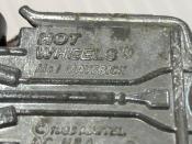 <p>Everyone knows what a Mad Maverick looks like, so we focused on the important part here: the base. While there is no shortage of Mighty Maverick Hot Wheels in circulation, there only are a few with its original name, "Mad Maverick," cast into the baseplate. It was changed due to a copyright issue with rival toy manufacturer Johnny Lightning, which had previously issued a Mad Maverick, so the pre-name-change cars are highly sought after. </p>