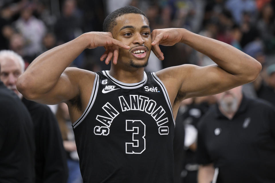 San Antonio Spurs' Keldon Johnson walks off the court after an NBA basketball game against the Cleveland Cavaliers, Monday, Dec. 12, 2022, in San Antonio. San Antonio won 112-111. (AP Photo/Darren Abate)