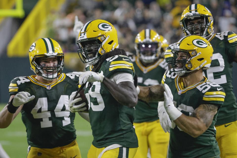 Green Bay Packers' De'Vondre Campbell celebrates his interception during the second half of an NFL football game against the Detroit Lions Monday, Sept. 20, 2021, in Green Bay, Wis. (AP Photo/Mike Roemer)