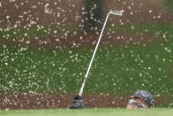 Phil Mickelson watches his shot from the bunker on the seventh hole during the weather delayed third round of the Masters golf tournament at Augusta National Golf Club on Saturday, April 8, 2023, in Augusta, Ga. (AP Photo/David J. Phillip)