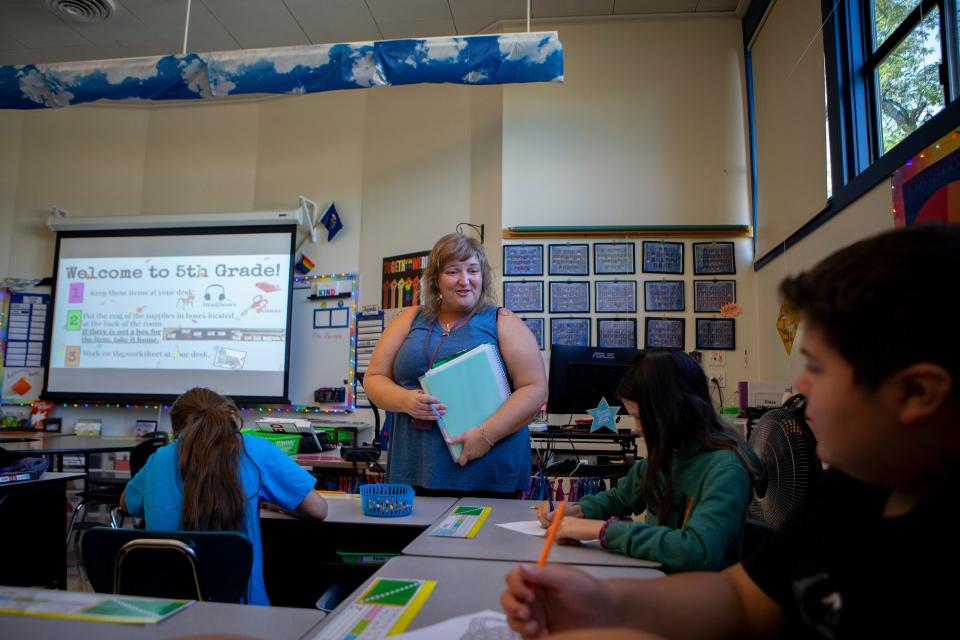 Teacher Sara Burgin checks in with students on the first day of classes last school year at Two Rivers-Dos Rios Elementary School in Springfield.