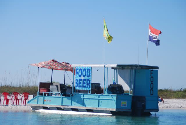 Tribune News Service via Getty Images / Getty Images Food Boat on Keewaydin Island Beach