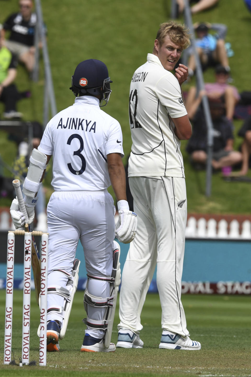 New Zealand's Kyle Jamieson, right, looks back at India's Prithvi Shaw after being hit to the boundary during the first cricket test between India and New Zealand at the Basin Reserve in Wellington, New Zealand, Friday, Feb. 21, 2020. (AP Photo/Ross Setford)