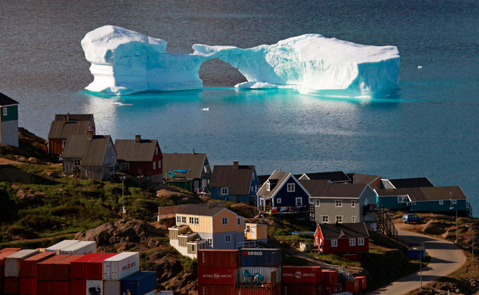 <p>An iceberg floats near a harbor in the town of Kulusuk, east Greenland August 1, 2009. (Bob Strong/Reuters) </p>