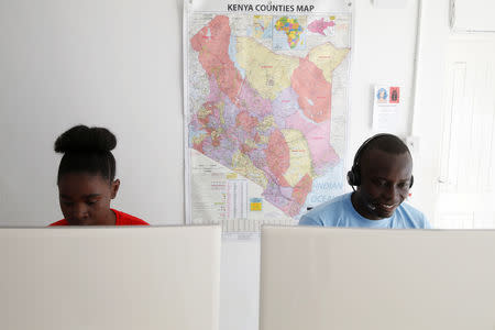 Dispatchers watch screens while on shift at the Rescue.co command centre in Nairobi, Kenya January 30, 2019. Picture taken January 30, 2019. REUTERS/Baz Ratner