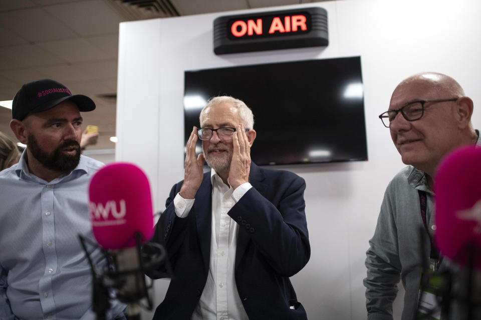 Jeremy Corbyn with (left to right) Chris Webb, Director of Communications for the Communication Workers Union, and Dave Ward, General Secretary for the CWU, during a visit to the CWU radio station at the Labour Party Conference.