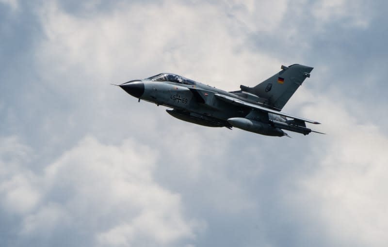 A Panavia 200 (PA-200) Tornado multi-purpose combat aircraft flies over the air base Fassberg on "Spotter Day". Christophe Gateau/dpa