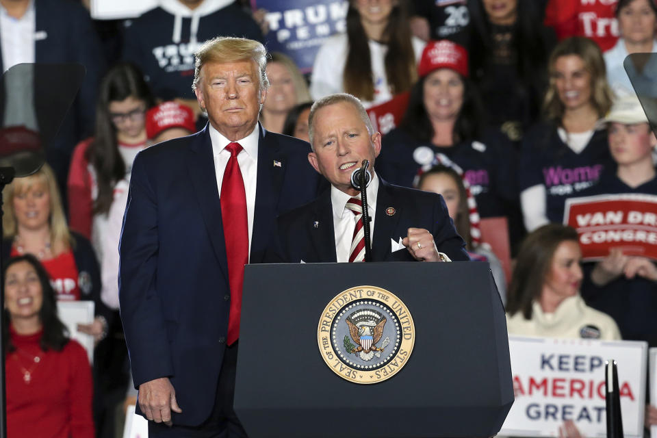 FILE - In this Jan. 28, 2020, file photo President Donald Trump, left, listens as Rep. Jeff Van Drew, R-New Jersey's 2nd district, speaks at a campaign rally in Wildwood, N.J. Jeff Van Drew is expected to speak during the Republican National Convention on Thursday, Aug. 27. (AP Photo/Mel Evans, File)