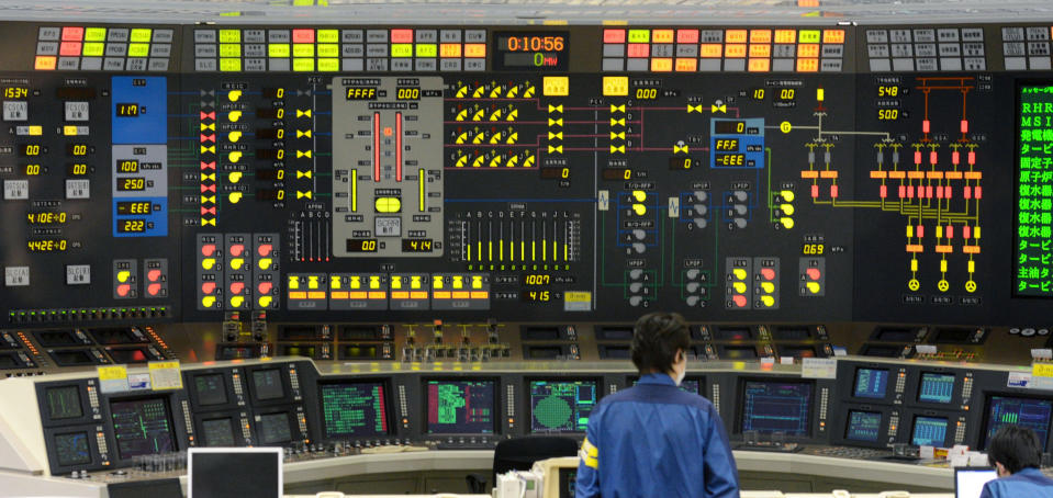 Workers man the central control room of the No. 6 reactor at the Tokyo Electric Power Company's nuclear power plant in Kariwa village in Kashiwazaki City, northwest of Tokyo early Monday, March 26, 2012, after it was taken off line. The nuclear reactor was taken off line for maintenance on Monday, leaving the country with only one of its 54 reactors operational following last year's devastating earthquake and tsunami. (AP Photo/Kyodo News) JAPAN OUT, MANDATORY CREDIT, NO LICENSING IN CHINA, HONG KONG, JAPAN, SOUTH KOREA AND FRANCE