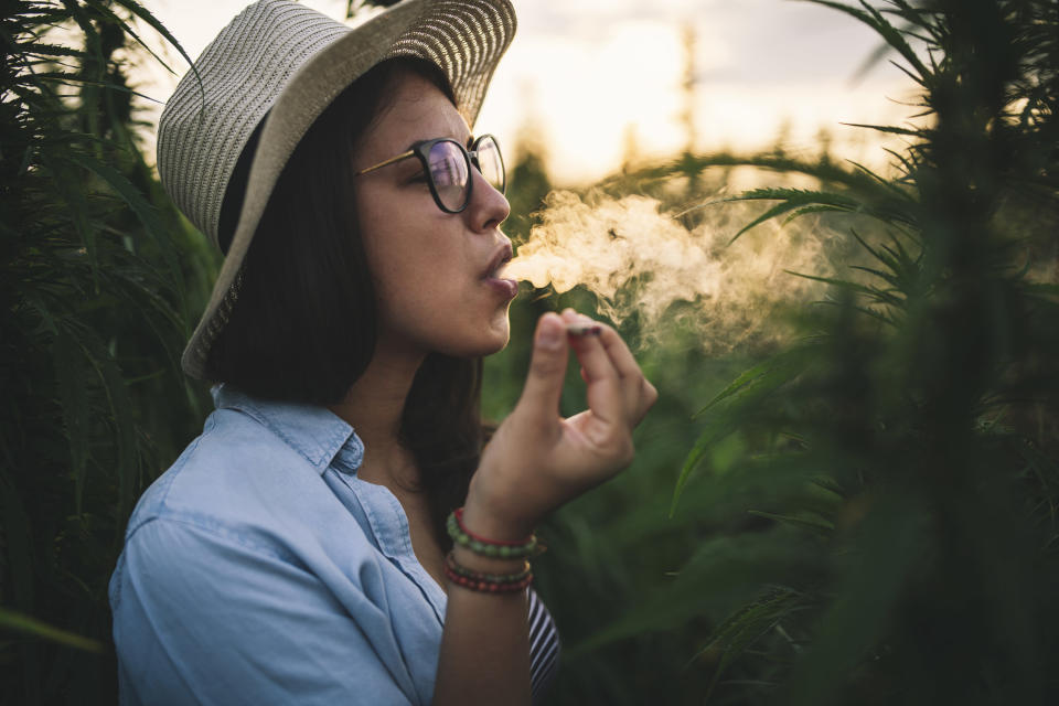 An image of a woman smoking cannabis