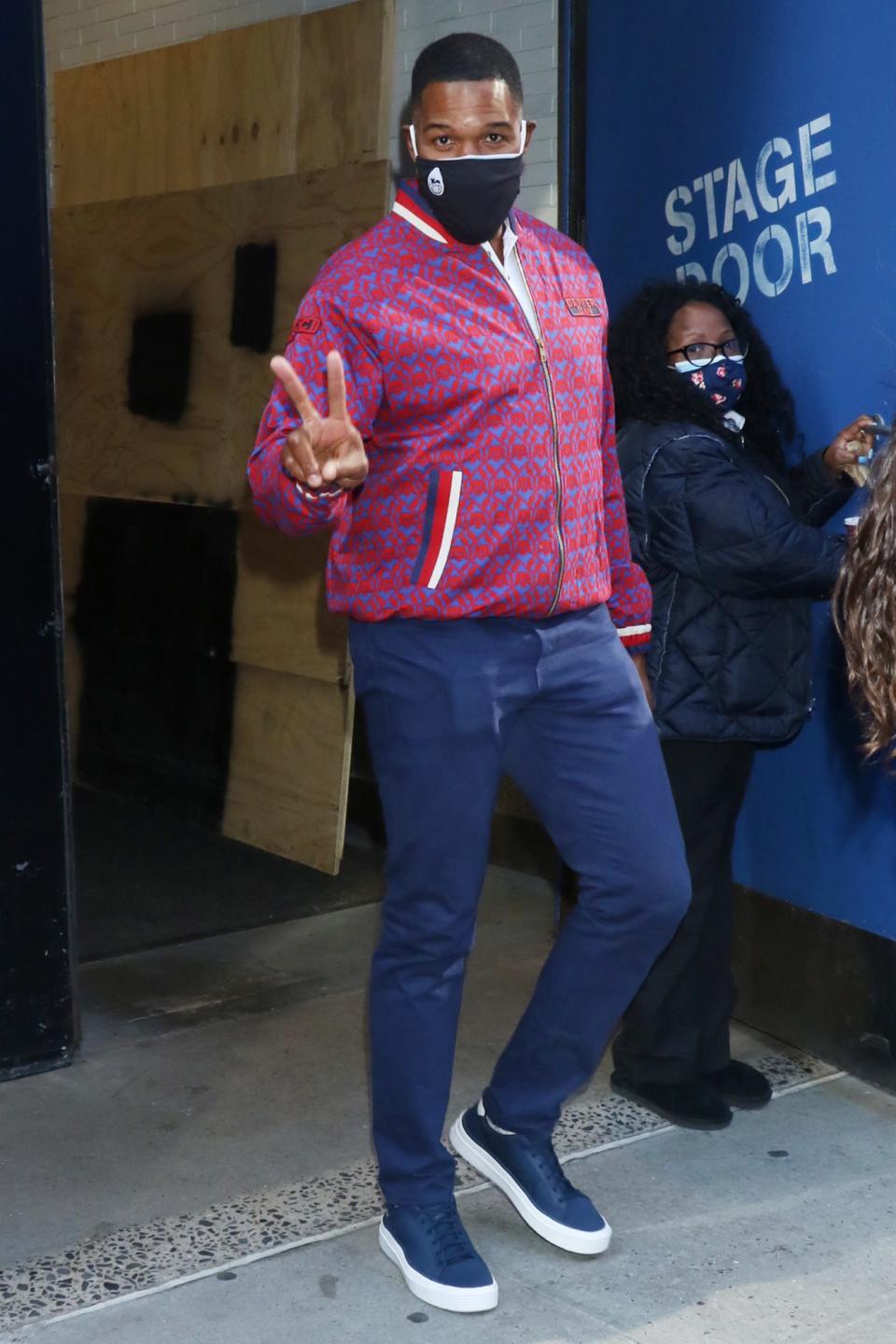 <p>Michael Strahan shares a peace sign while leaving ABC studios on Wednesday in N.Y.C.</p>