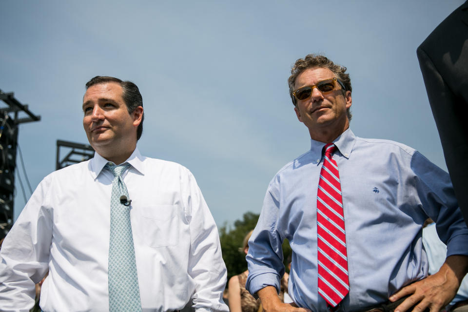 WASHINGTON, DC - SEPTEMBER 10:  U.S. Sen. Ted Cruz (R-TX) (L) and Sen. Rand Paul (R-KY) wait to speak at the 'Exempt America from Obamacare' rally,  on Capitol Hill, September 10, 2013 in Washington, DC. Some conservative lawmakers are making a push to try to defund the health care law as part of the debates over the budget and funding the federal government. (Photo by Drew Angerer/Getty Images)