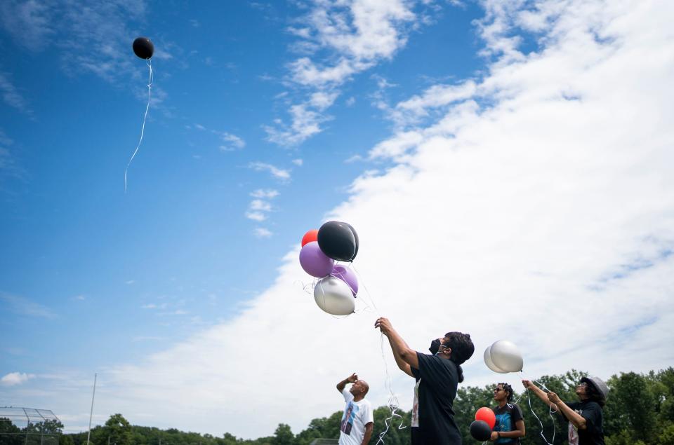 Jul 31, 2022; Columbus, Ohio, United States;  Lamont Turner died by suicide after being sexually abused by his doctor. His family releases balloons outside the school he previously worked at, Walnut Ridge, at 1 p.m., July 31, which is the anniversary of his death. 