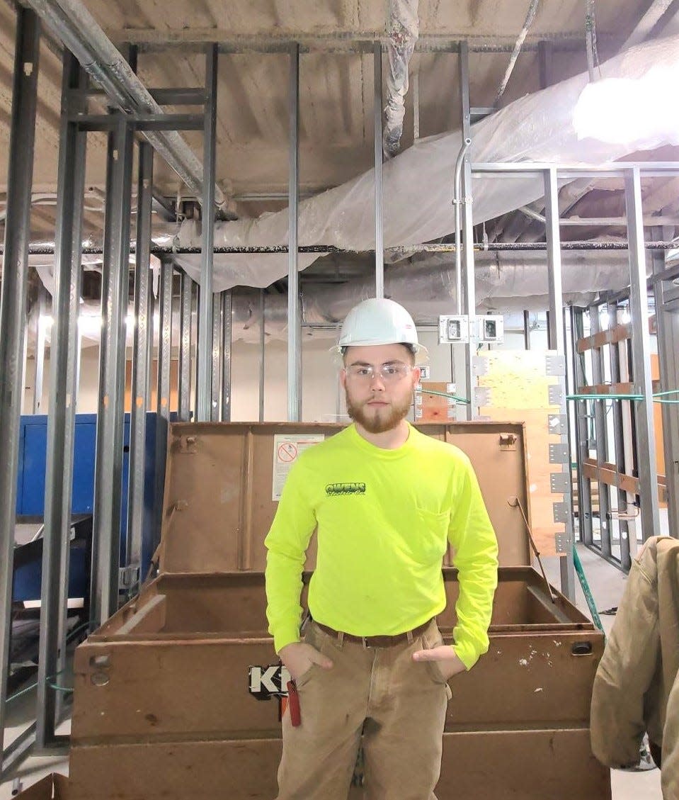 Tyler Watson, an alumnus of the Ashland-West Holmes Career Building Trades program has landed a position as an electrician with Owens Electric Co. out of Marion. Here Watson is seen on a job at Wyandotte Memorial Hospital in Upper Sandusky.