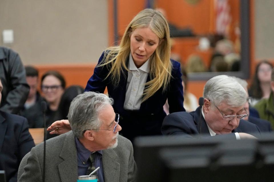 Gwyneth Paltrow speaks with retired optometrist Terry Sanderson, left, as she walks out of the courtroom following the reading of the verdict in their lawsuit trial, Thursday, March 30, 2023, in Park City, Utah (AP)