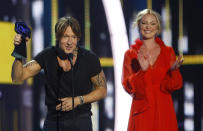 <p>Keith Urban accepts the award for male video of the year for “Blue Ain’t Your Color” at the CMT Music Awards at Music City Center on Wednesday, June 7, 2017, in Nashville, Tenn. Looking on in background right is presenter Katherine Heigl. (Photo by Wade Payne/Invision/AP) </p>