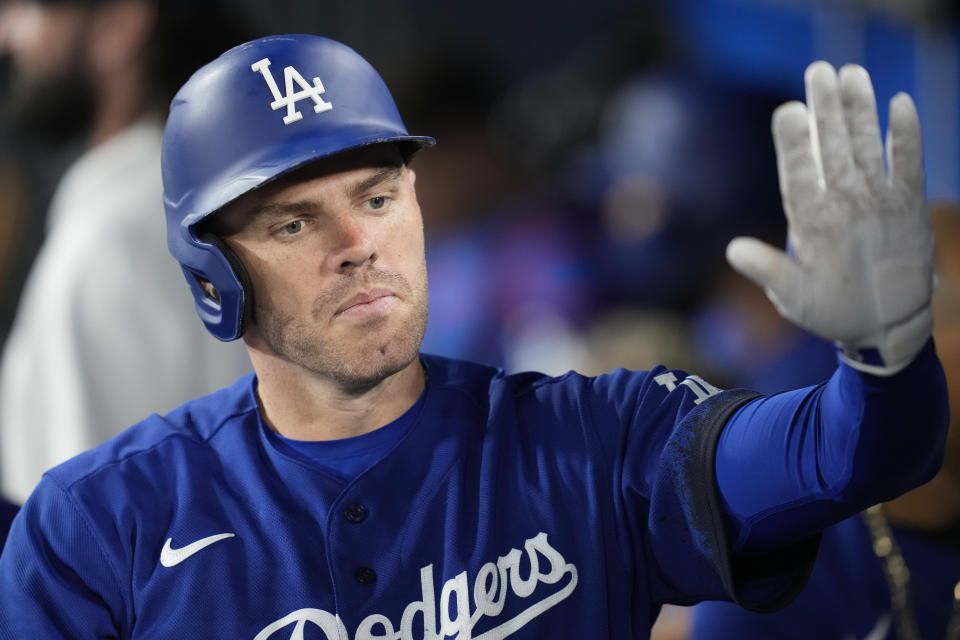 Los Angeles Dodgers' Freddie Freeman (5) celebrates in the dugout after hitting a home run during the eighth inning of a baseball game against the Oakland Athletics in Los Angeles, Thursday, Aug. 3, 2023. (AP Photo/Ashley Landis)