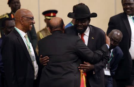 South Sudan's President Salva Kiir meets Sudan's President Omar Al-Bashir during the 32nd Extra-Ordinary Summit of IGAD Assembly of Heads of State and Government in Addis Ababa, Ethiopia June 21, 2018. REUTERS/Tiksa Negeri