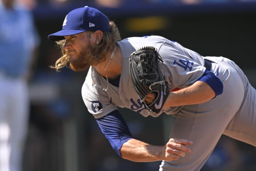 Los Angeles Dodgers relief pitcher Craig Kimbrel throws to a Kansas City Royals batter during the eighth inning of a baseball game, Sunday, Aug. 14, 2022, in Kansas City, Mo. (AP Photo/Reed Hoffmann)