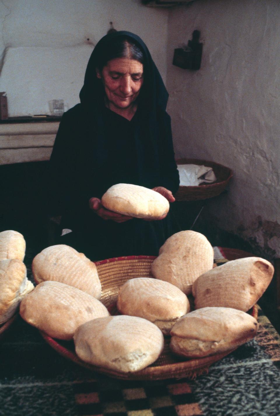 sardinian woman handling sourdough bread