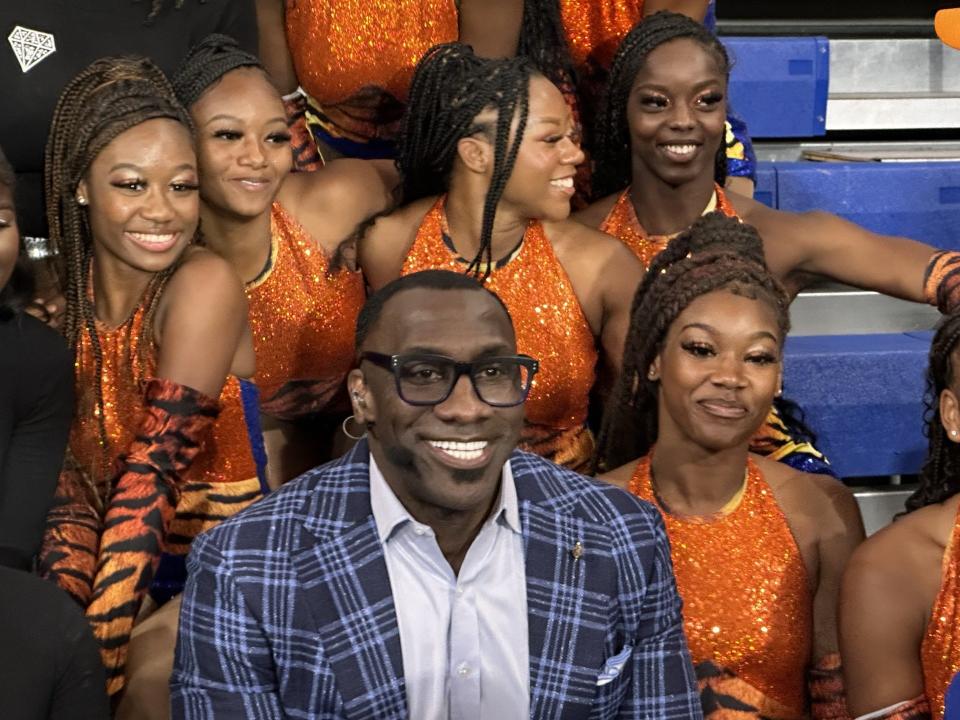 Shannon Sharpe poses with members of the Savannah State Marching Band after a broadcast of "First Take" at SSU Monday.