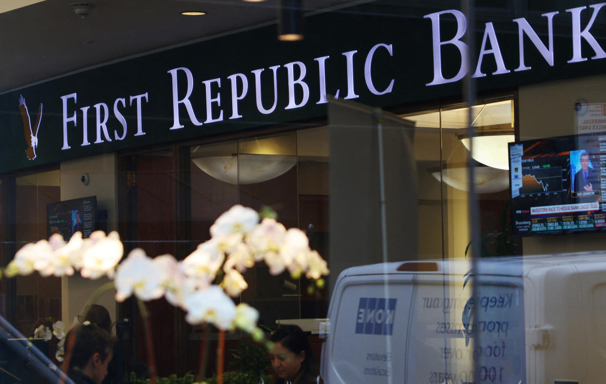 People are seen inside the First Republic Bank branch in Midtown Manhattan in New York City, New York, U.S., March 13, 2023. REUTERS/Mike Segar
