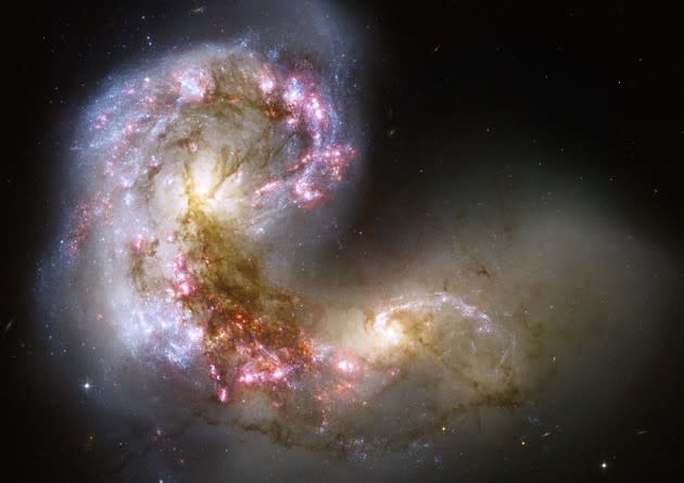 The Antennae galaxies, shown here, mark the first installment of our annual Hubble Space Telescope Advent Calendar. <a href="https://www.theatlantic.com/photo/2016/12/2016-hubble-space-telescope-advent-calendar/509306/" rel="nofollow noopener" target="_blank" data-ylk="slk:Check back here;elm:context_link;itc:0;sec:content-canvas" class="link ">Check back here</a> for new images every day until Sunday, December 25. (NASA, ESA, and the Hubble Heritage Team)