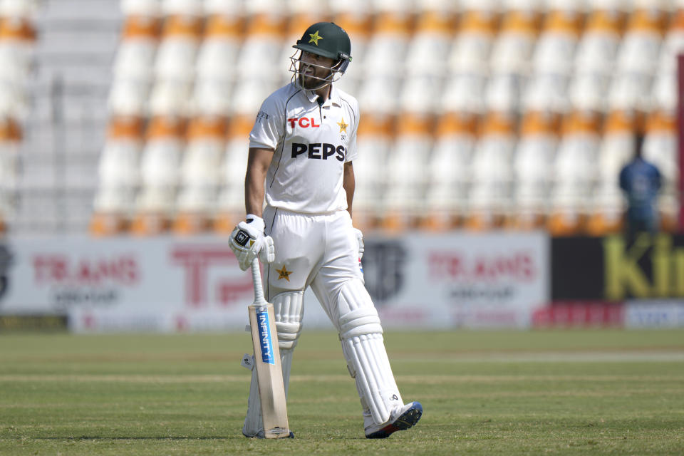 Pakistan's Salman Ali Agha reacts as he walks off the field after his dismissal during the fifth day of the first test cricket match between Pakistan and England, in Multan, Pakistan, Friday, Oct. 11, 2024. (AP Photo/Anjum Naveed)