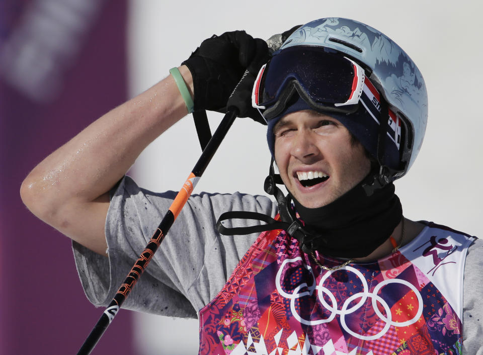 Bobby Brown of the United States reacts after crashing during the men's ski slopestyle final at the Rosa Khutor Extreme Park, at the 2014 Winter Olympics, Thursday, Feb. 13, 2014, in Krasnaya Polyana, Russia. (AP Photo/Gero Breloer)