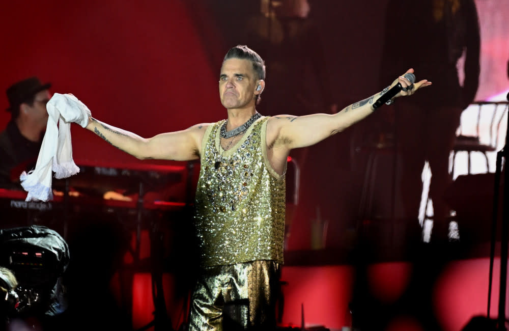 Robbie Williams has paid tribute to the late fan credit:Bang Showbiz