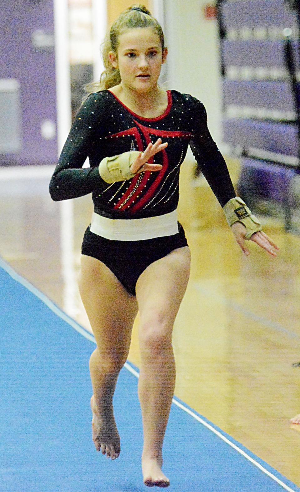 Sisseton's Isabelle Skarnagel dashes down the runway to the vault Thursday during the Watertown Invitational gymnastics meet in the Civic Arena.