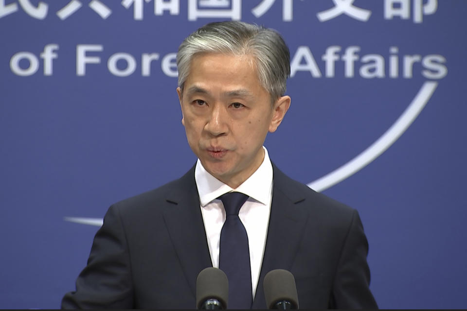 Chinese foreign ministry spokesman, Wang Wenbin, speaks during a routine press conference where he congratulated U.S. president-elect Joe Biden at the foreign ministry in Beijing on Friday, Nov. 13, 2020. China on Friday became one of the last major countries to congratulate Joe Biden on being elected U.S. president. (AP Photo/Liu Zheng)