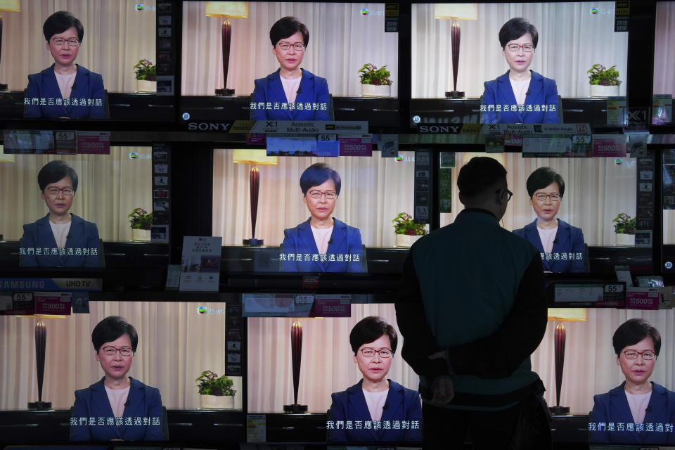 A man watches the television message that Hong Kong Chief Executive Carrie Lam makes an announcement on the extradition bill, at a home electronics retailer in Hong Kong, on Wednesday, Sept. 4, 2019. Chief Executive Lam has announced the government will formally withdraw an extradition bill that has sparked months of demonstrations in the city, bowing to one of the protesters' demands. The bill would have allowed Hong Kong residents to be sent to mainland China for trials. It sparked massive protests that have become increasingly violent and caused the airport to shut down earlier this month. (AP Photo/Vincent Yu)