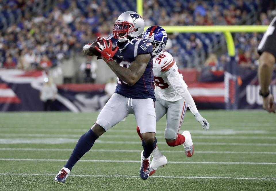 New England Patriots wide receiver Josh Gordon (10) catches a pass in front New York Giants defensive back Henre' Toliver of in the first half of an NFL preseason football game, Thursday, Aug. 29, 2019, in Foxborough, Mass. (AP Photo/Elise Amendola)