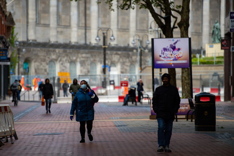 Pedestrians walking on Hill Street in Birmingham city centre, as the UK continues in lockdown to help curb the spread of the coronavirus.