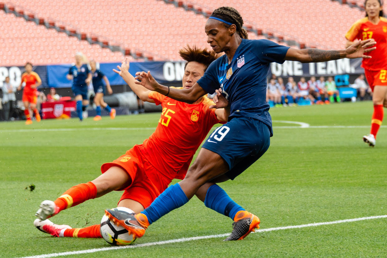 Lou Jiahui&nbsp;(left) of China battles with Crystal Dunn of the U.S. in&nbsp;Cleveland on June 12, 2018.&nbsp;Compared with male players, female players get paid less and have fewer resources. (Photo: Jason Miller / Getty Images)