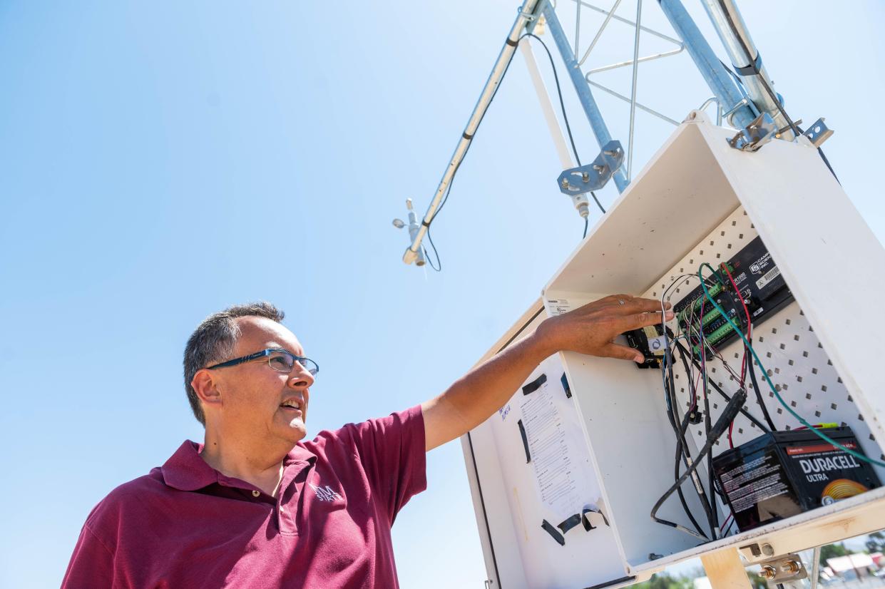 David DuBois, New Mexico state climatologist and director of the New Mexico Climate Center, discusses a weather station installed at New Mexico State University’s Fabián García Science Center.