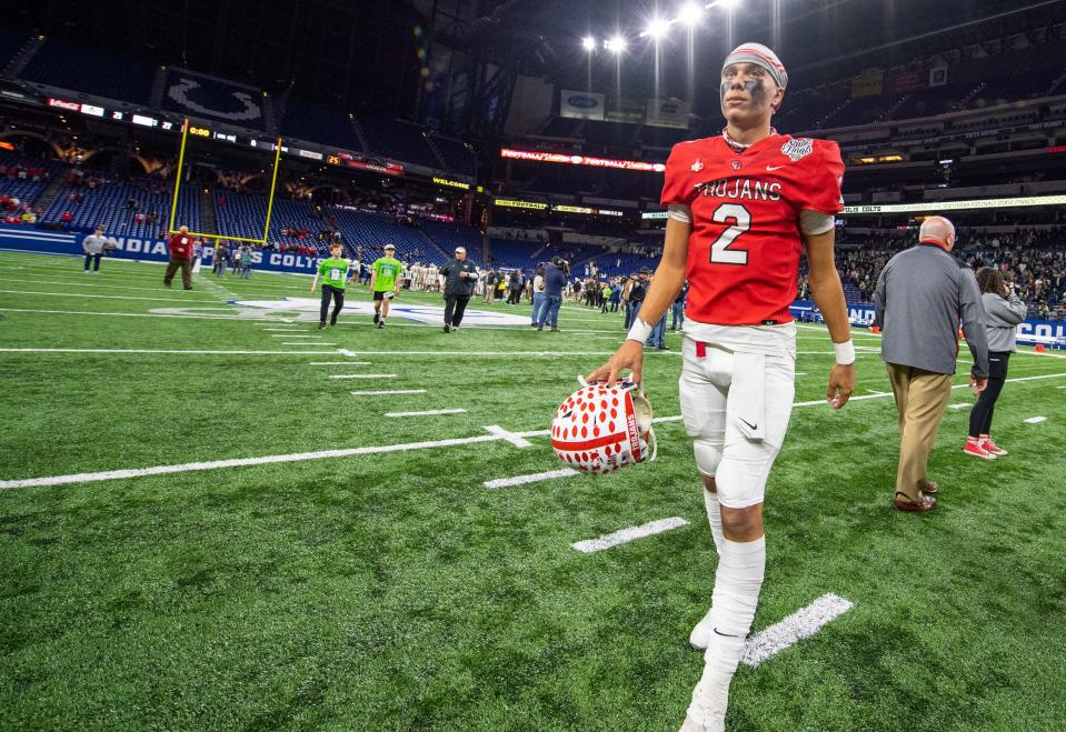 Center Grove High School senior quarterback Tayven Jackson (2) walks off the field after an IHSAA class 6A State Championship football game against Westfield High School, Saturday, Nov. 27, 2021, at Lucas Oil Stadium. Center Grove won 27-21.