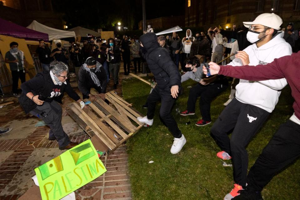 Counter protesters attack pro-Palestinian protesters on 1 May at the University of California, Los Angeles campus. It is unclear as of Wednesday afternoon how many arrests police made, if any (AFP via Getty Images)