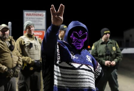 An attendee wears an alien mask at the gate of Area 51 as an influx of tourists responding to a call to 'storm' Area 51, a secretive U.S. military base believed by UFO enthusiasts to hold government secrets about extra-terrestrials, is expected in Rachel