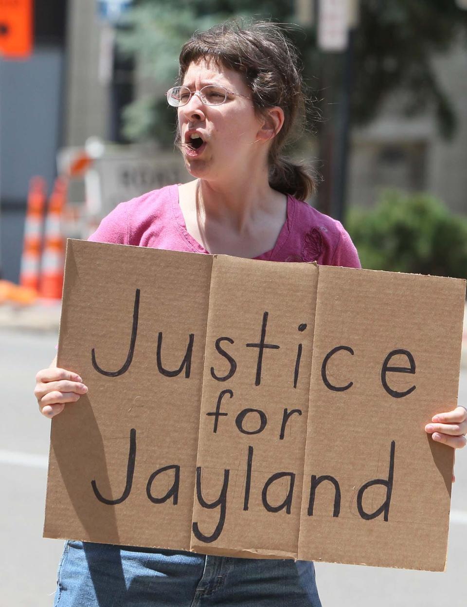 Emily Baldridge, a co-worker of Jaymeisha Beasley, the fiance of Jayland Walker, joins a protest of the Akron Police Department's shooting of Walker in front of APD at the Harold K. Stubbs Justice Center Friday afternoon in downtown Akron. Beasley was struck and killed by a hit-skip driver last month in Cincinnati.