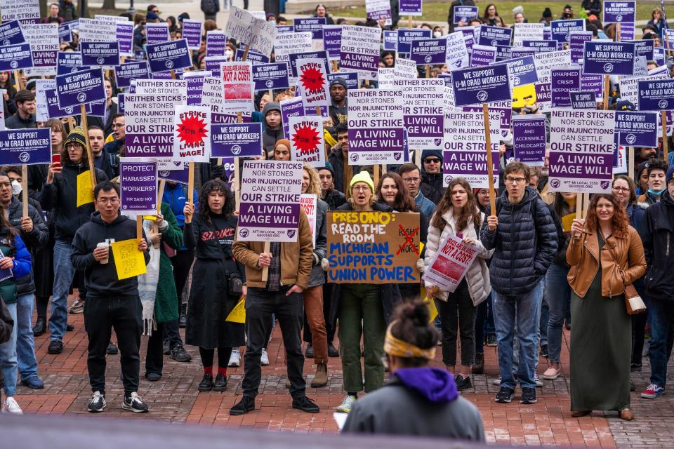 A crowd cheers on a speaker after University of Michigan graduate student workers went on strike while joined with members of the Graduate Employees Organization and allies gather for a rally at The Diag on the campus in Ann Arbor on March 29, 2023.